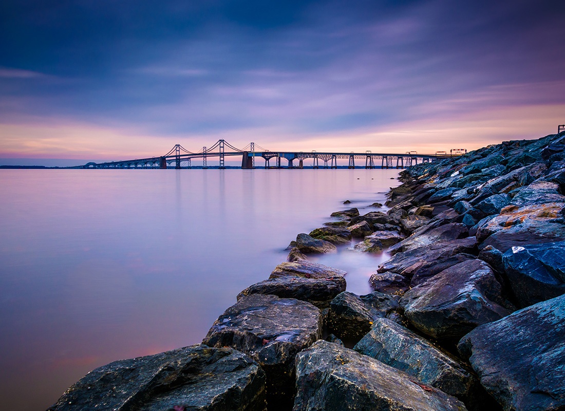 Insurance Solutions - Long Exposure of a Jetty and the Chesapeake Bay Bridge